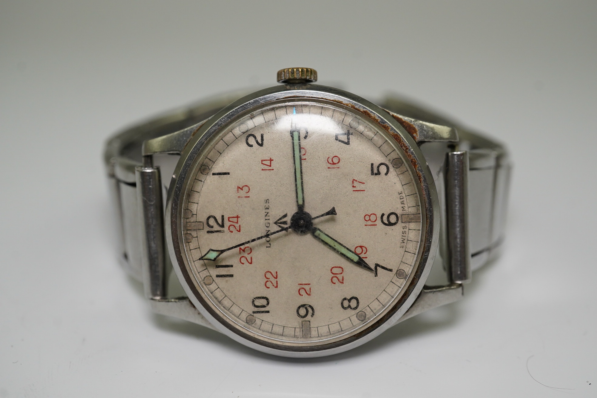 A gentleman's 1940's stainless steel Longines military issue manual wind wrist watch